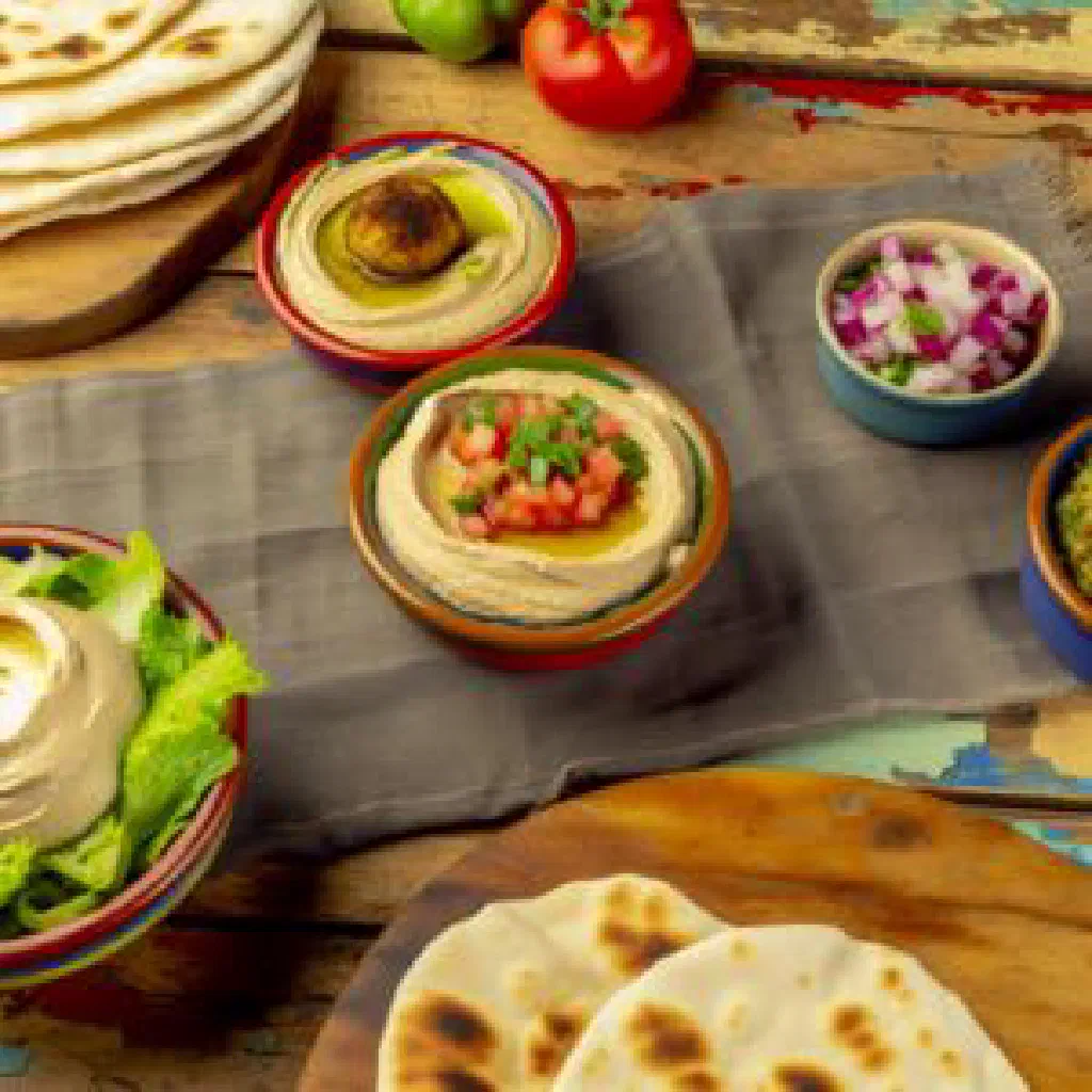Albanian maza platter with feta, olives, cured sausage and fresh vegetables