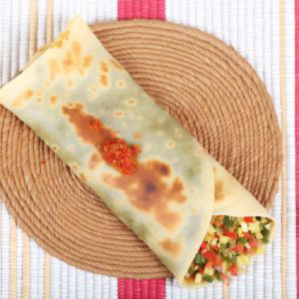 Golden pan-fried Algerian mahjouba stuffed flatbreads on a plate