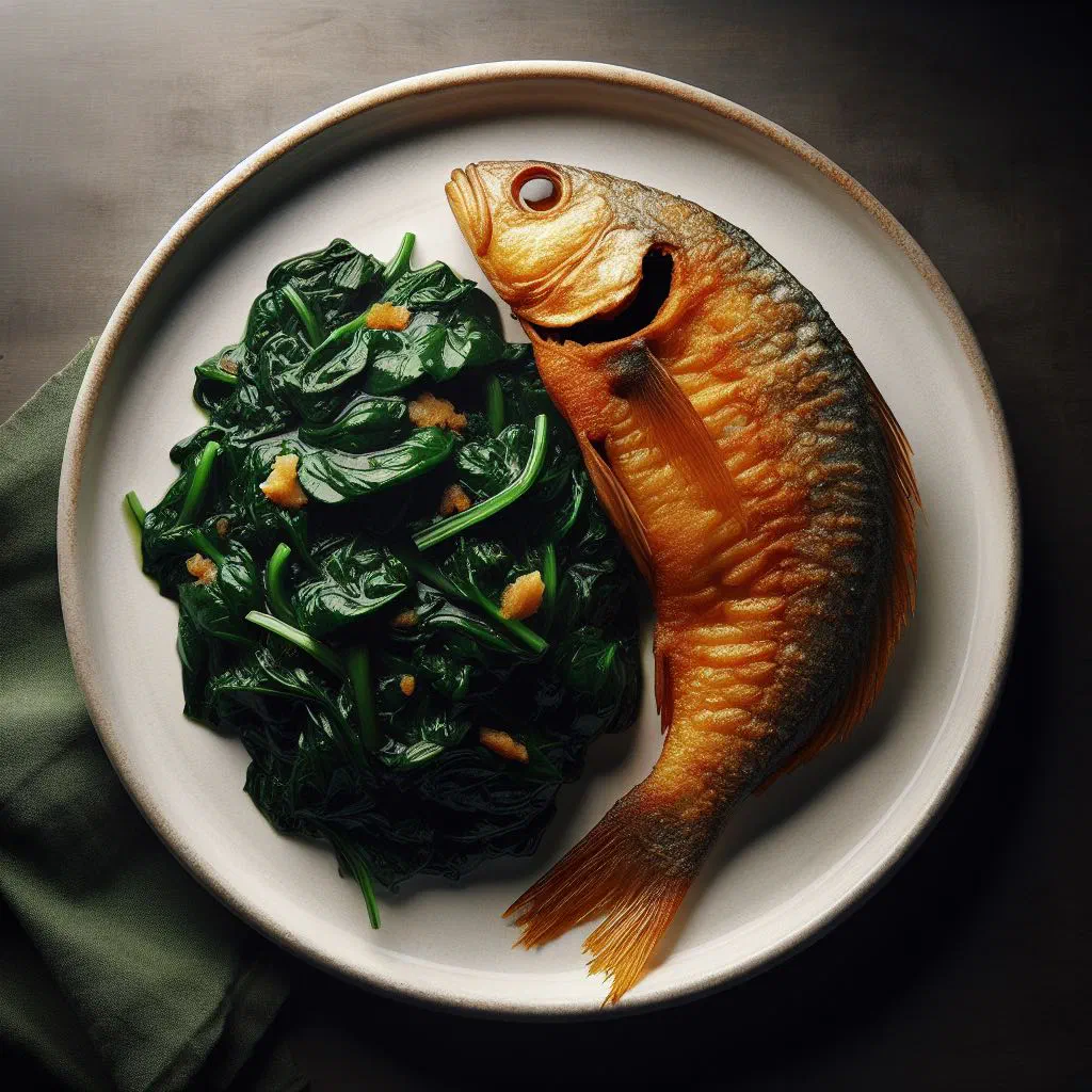Angolan fumbua com peixe with pan-cooked fish and a bowl of fufu