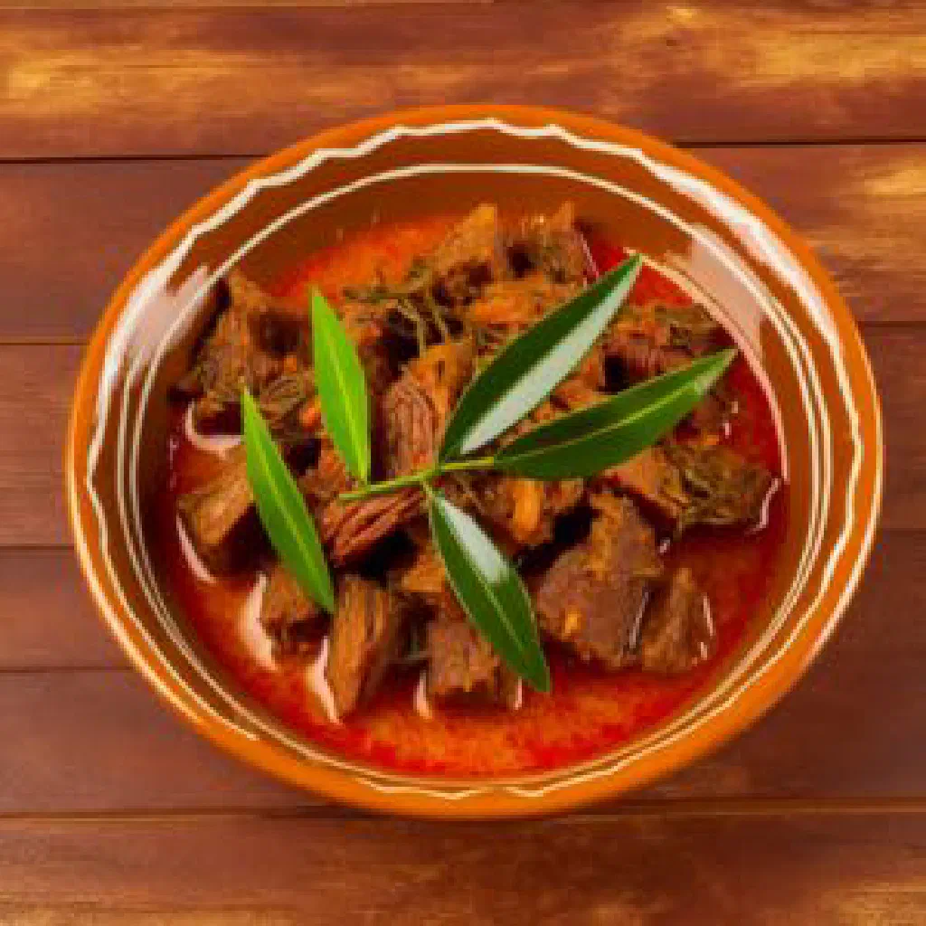 Angolan fish stew with palm oil, peppers and fresh herbs