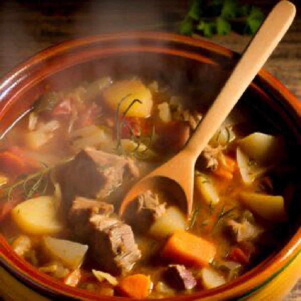 Zeytun with fragrant rice, tender meat and fresh herbs in a bowl