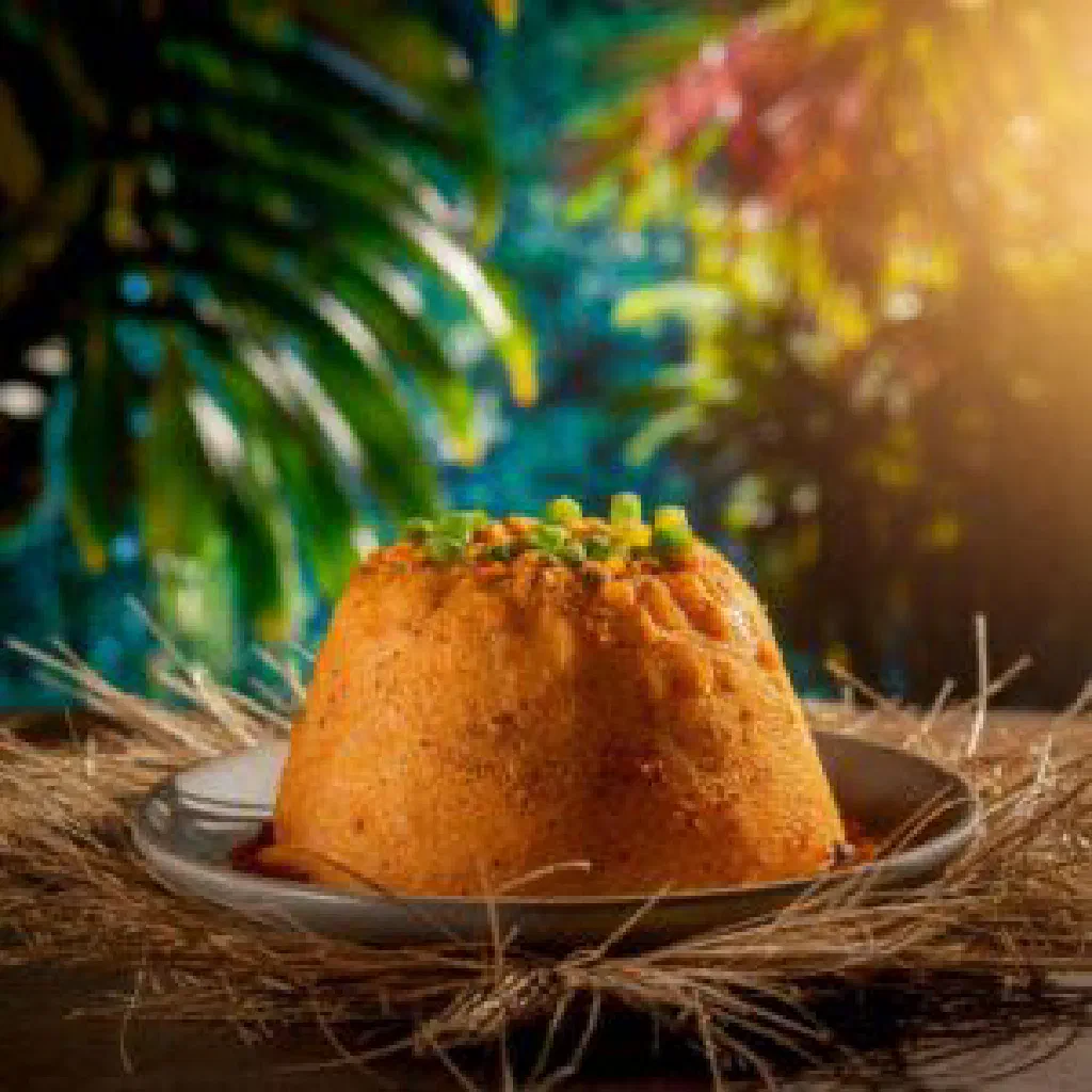 Slice of Belizean boil cake made with grated coconut and warm spices