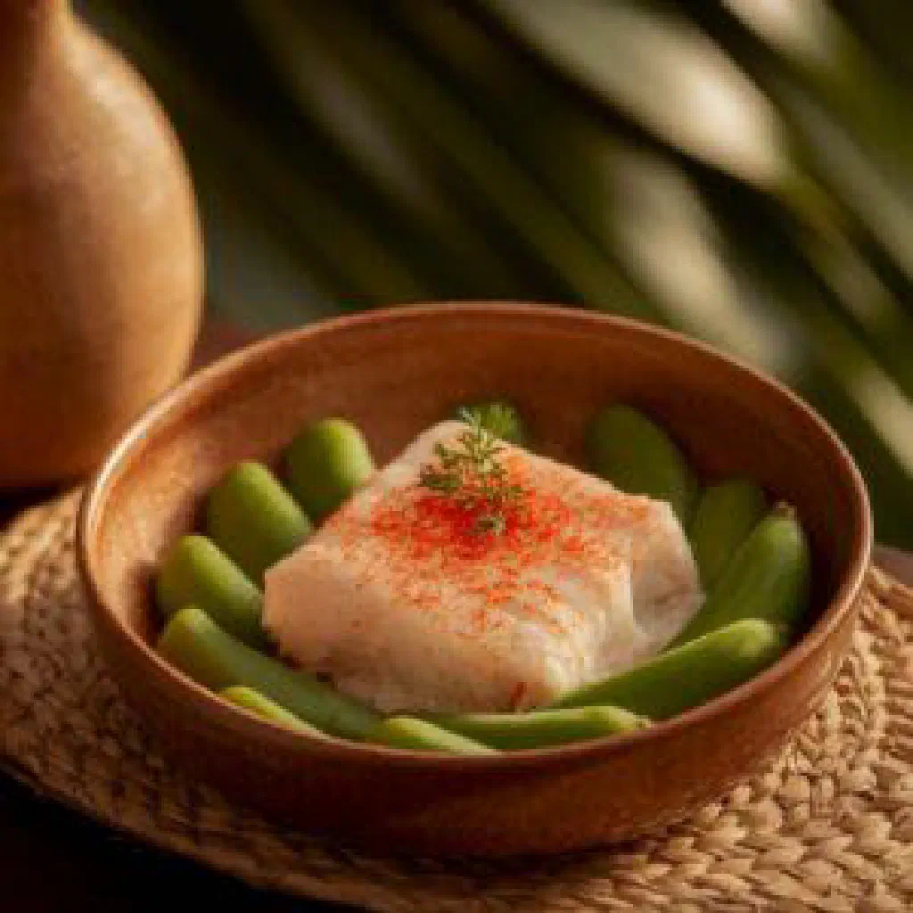 Hudut Baruru with fish in coconut milk sauce and mashed plantain