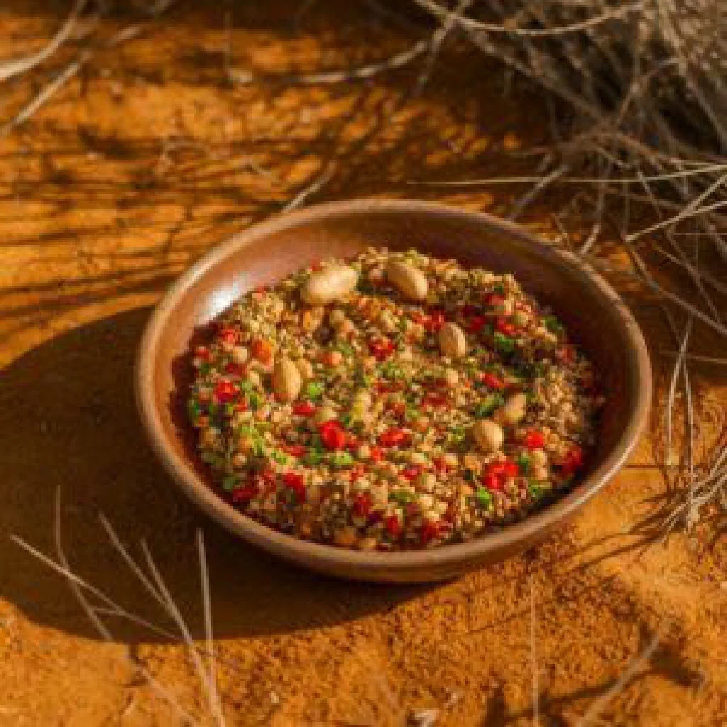 Steamed cornmeal dumplings served with creamy peanut sauce