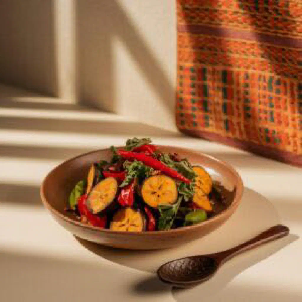Telibo with seasoned rice, fish and fresh herbs in a bowl
