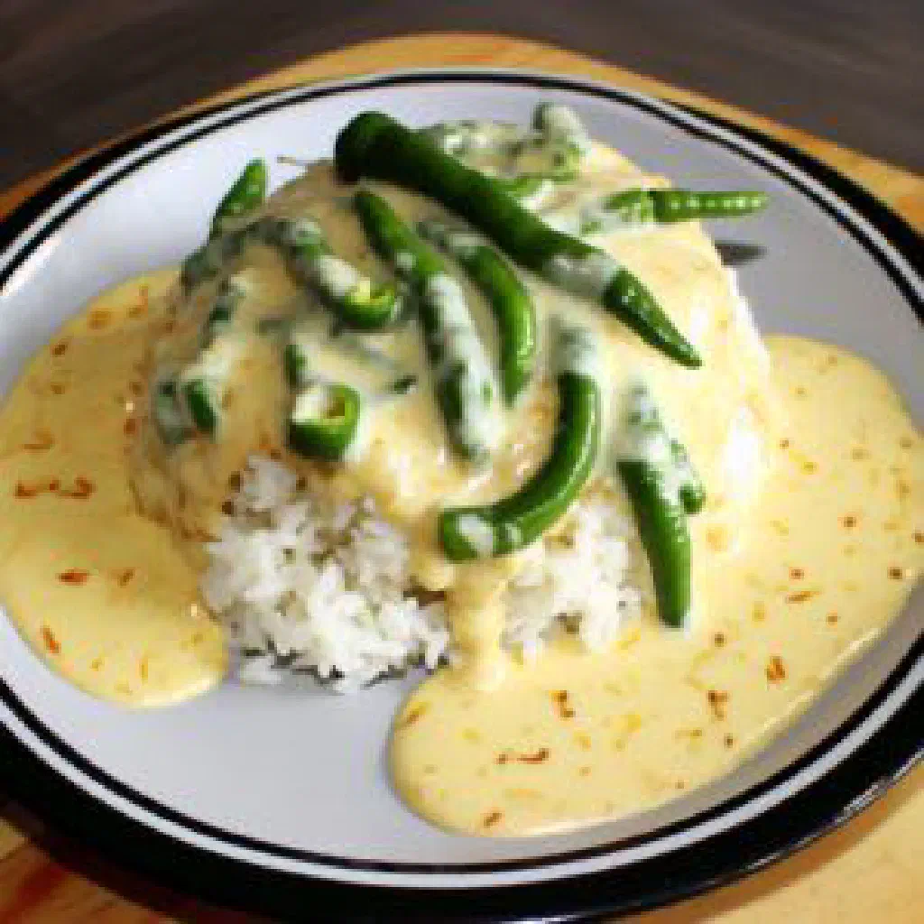 Bowl of ema dashi with green chillies in a creamy cheese sauce
