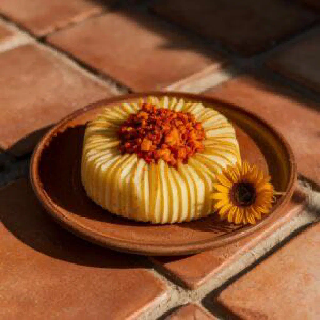 Bowl of Bolivian jankaquipa stew with potatoes, vegetables and meat garnished with coriander
