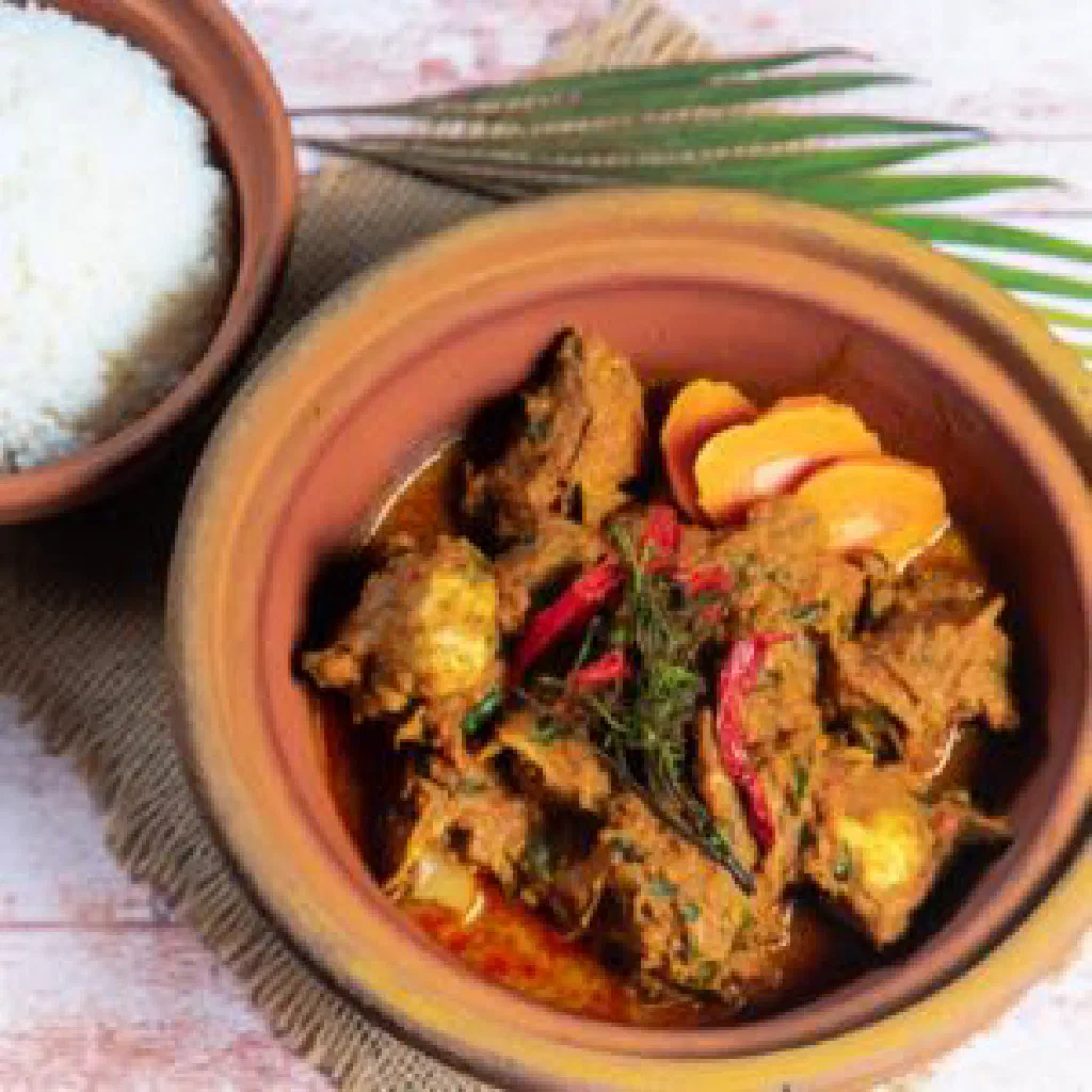 Rendang ayam chicken simmered in a rich, spiced coconut sauce