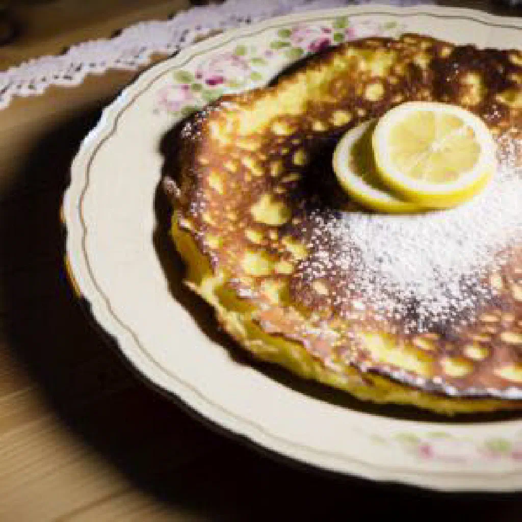 Light, fluffy serabi pancakes served with coconut cream
