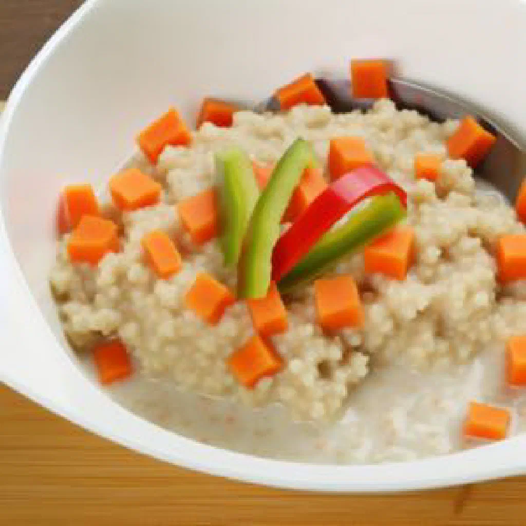 Bowl of Bassi Salté with steamed millet, diced carrots and peppers, garnished with fresh herbs
