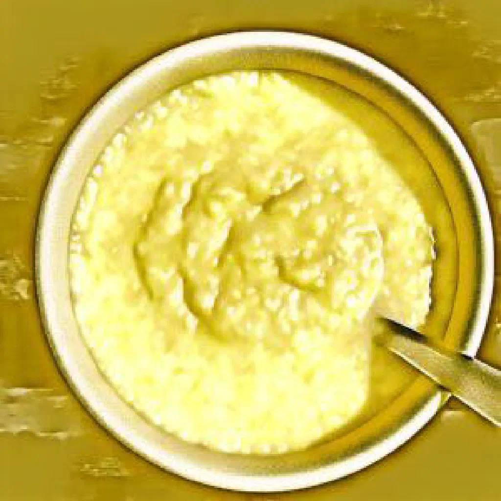 A firm mound of Umutsima cornmeal served with vegetable sides