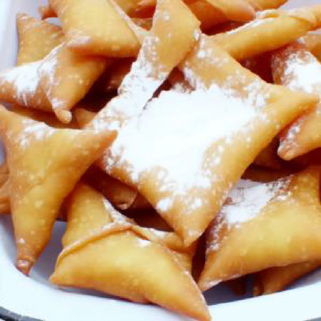 Klouikloui with tender yam pieces and roasted peanuts in a bowl