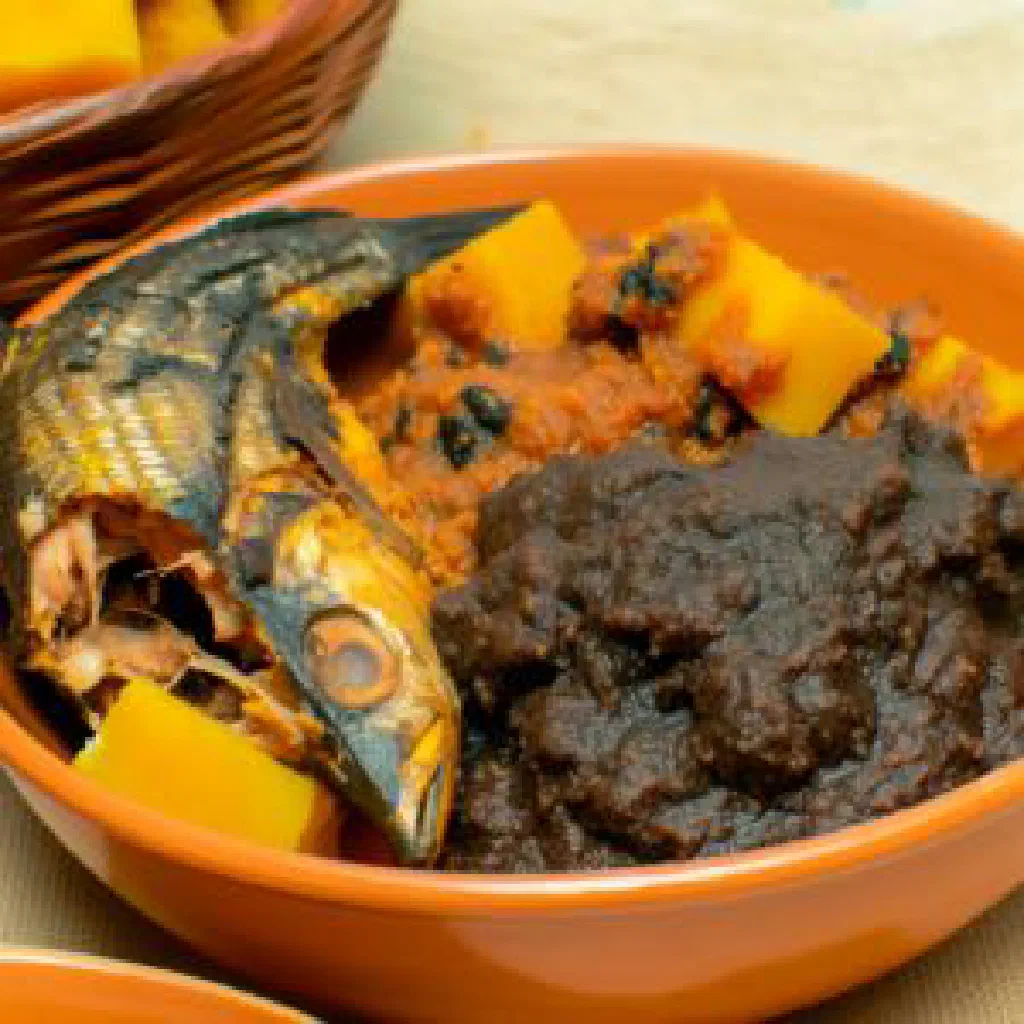 Dark, spicy Mbongo Tchobi fish stew garnished with fresh coriander