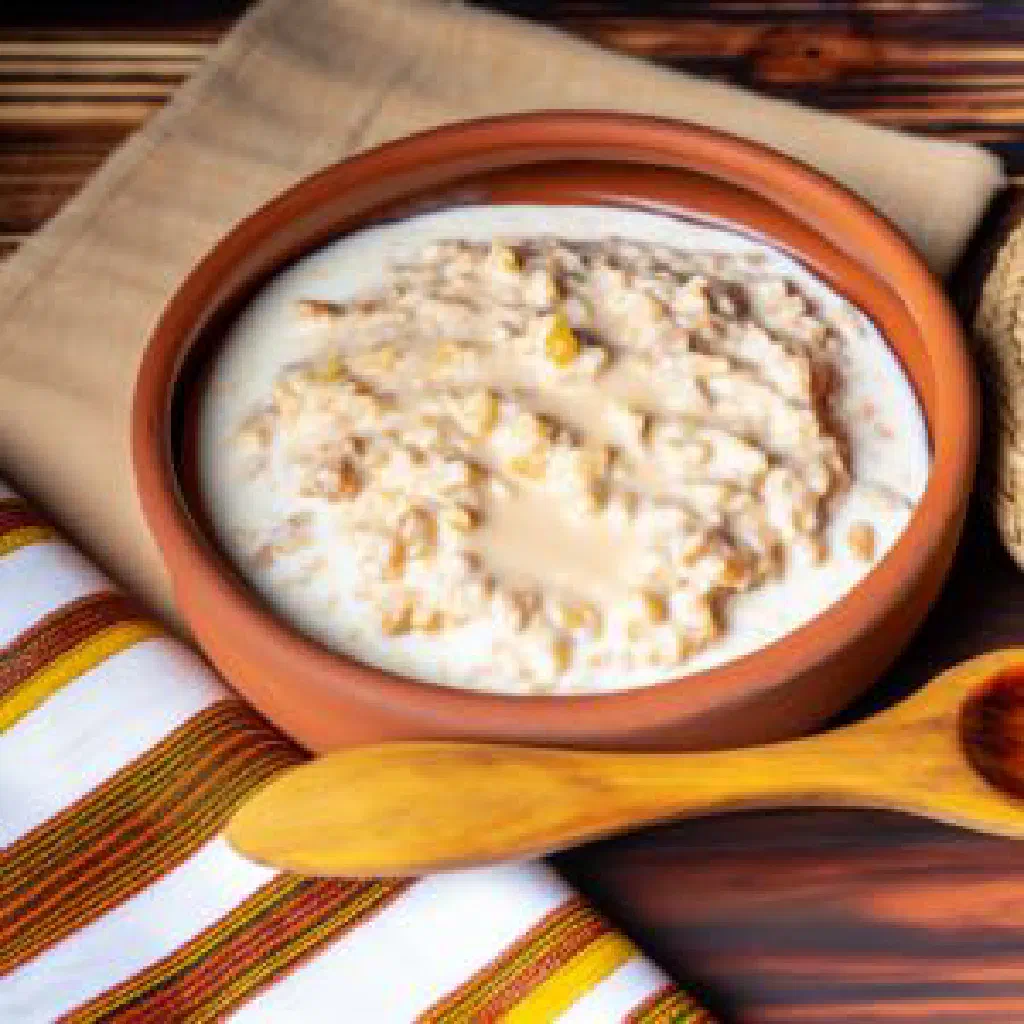 Warm Chadian flatbreads served with a creamy garlic yoghurt sauce and fresh herbs