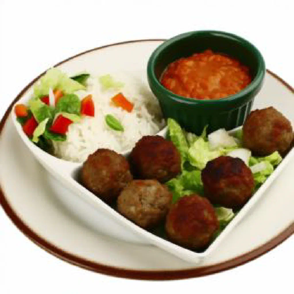Comorian katlesi with tender chicken in a golden coconut sauce