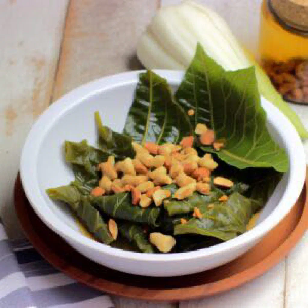 A bowl of saka-saka ya mwamba, stewed cassava leaves with peanuts