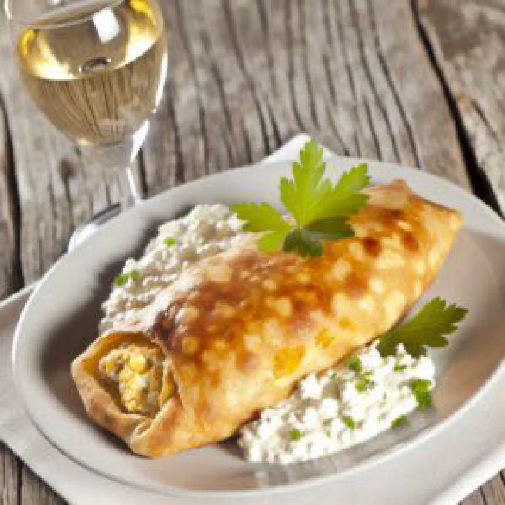 Baked Croatian štrukli with golden curd cheese filling