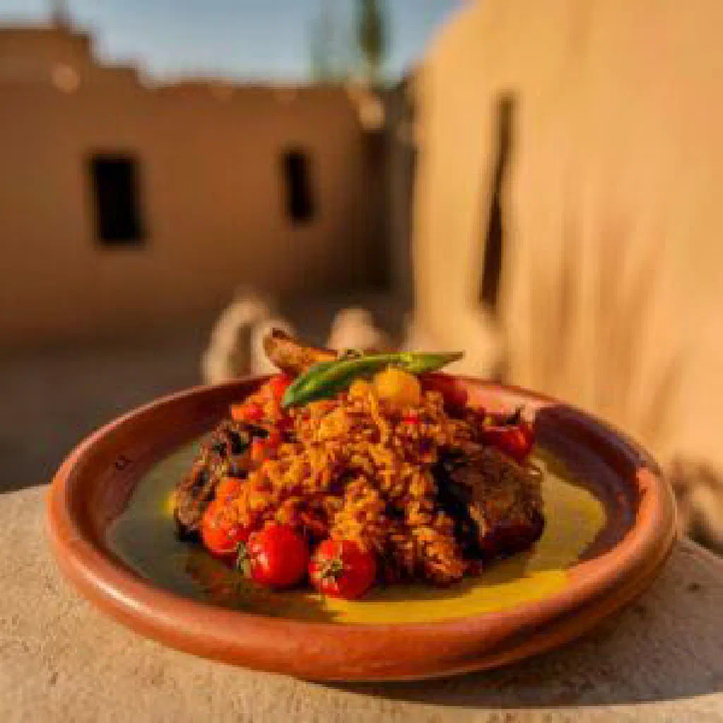 Bowl of Fettah with soaked flatbread, tender lamb and fresh coriander