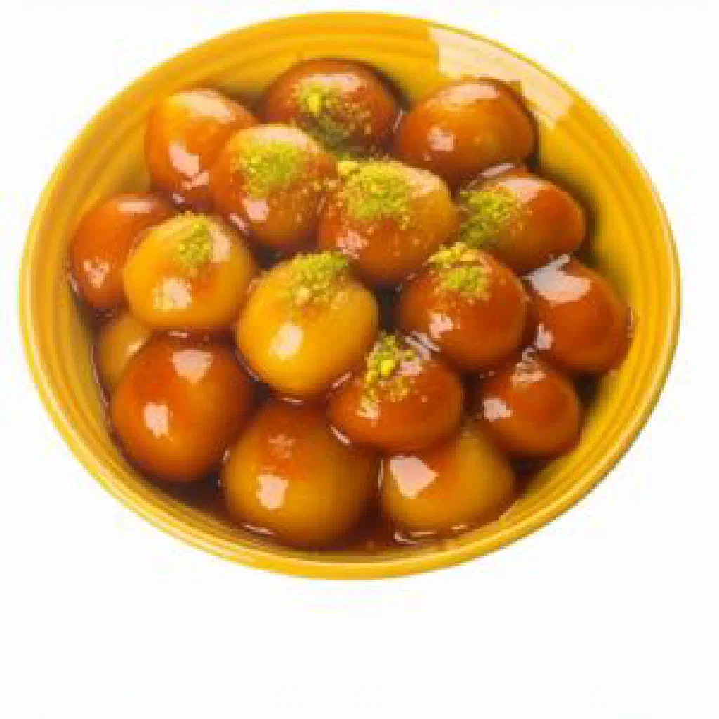 Golden fried awwama dough balls glazed with sweet syrup