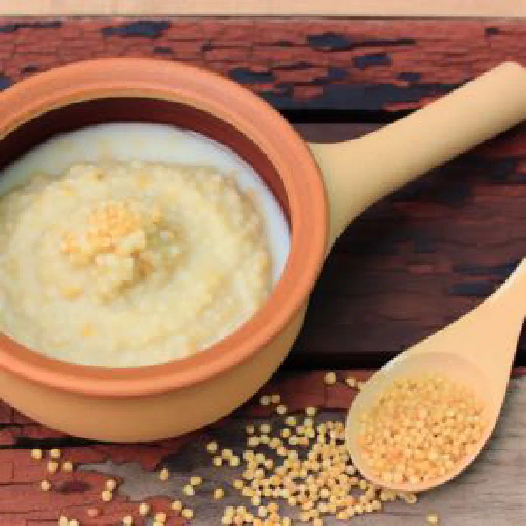 A bowl of creamy Ethiopian atmit porridge sweetened with honey