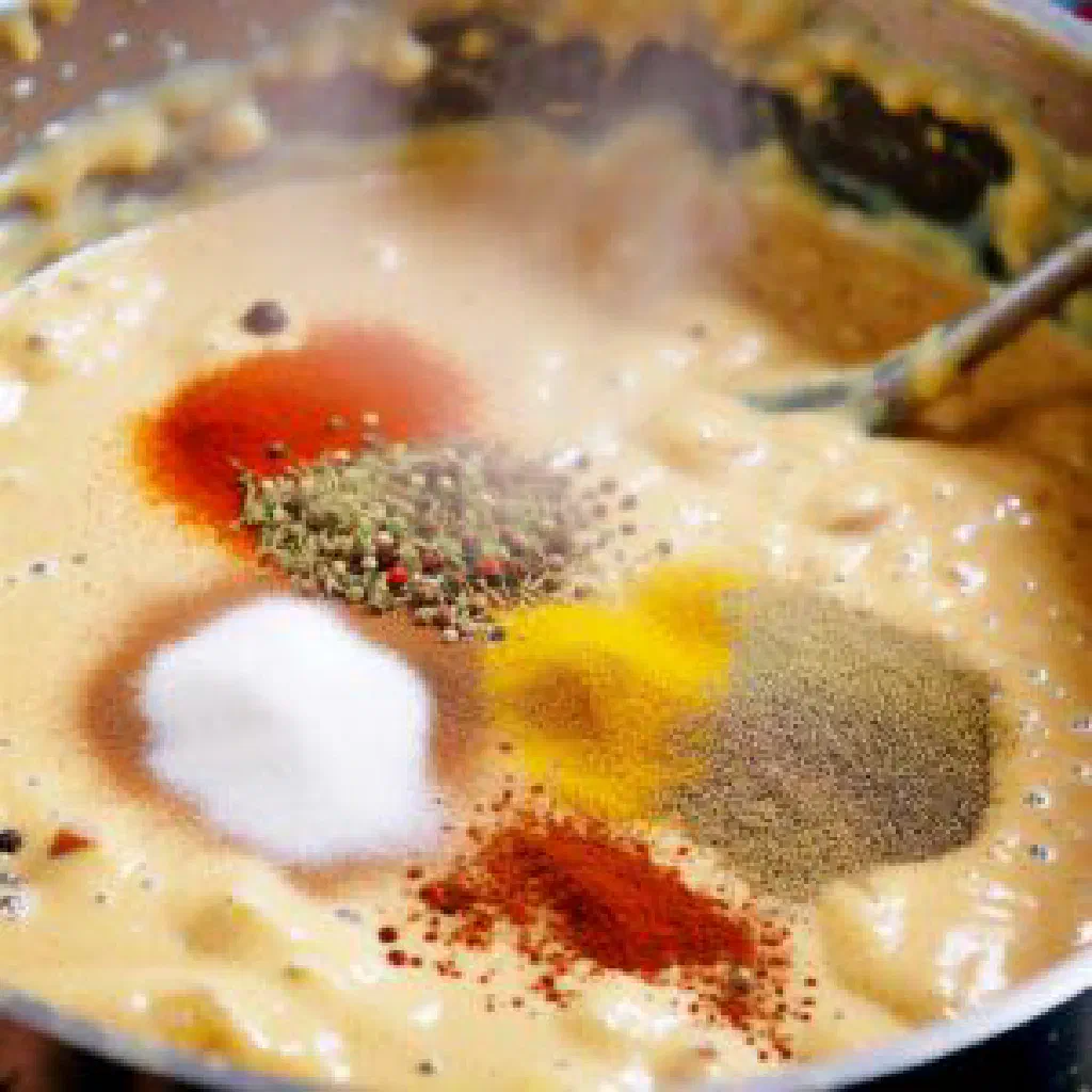 Bowl of Ethiopian genfo porridge with a well of berbere-spiced oil