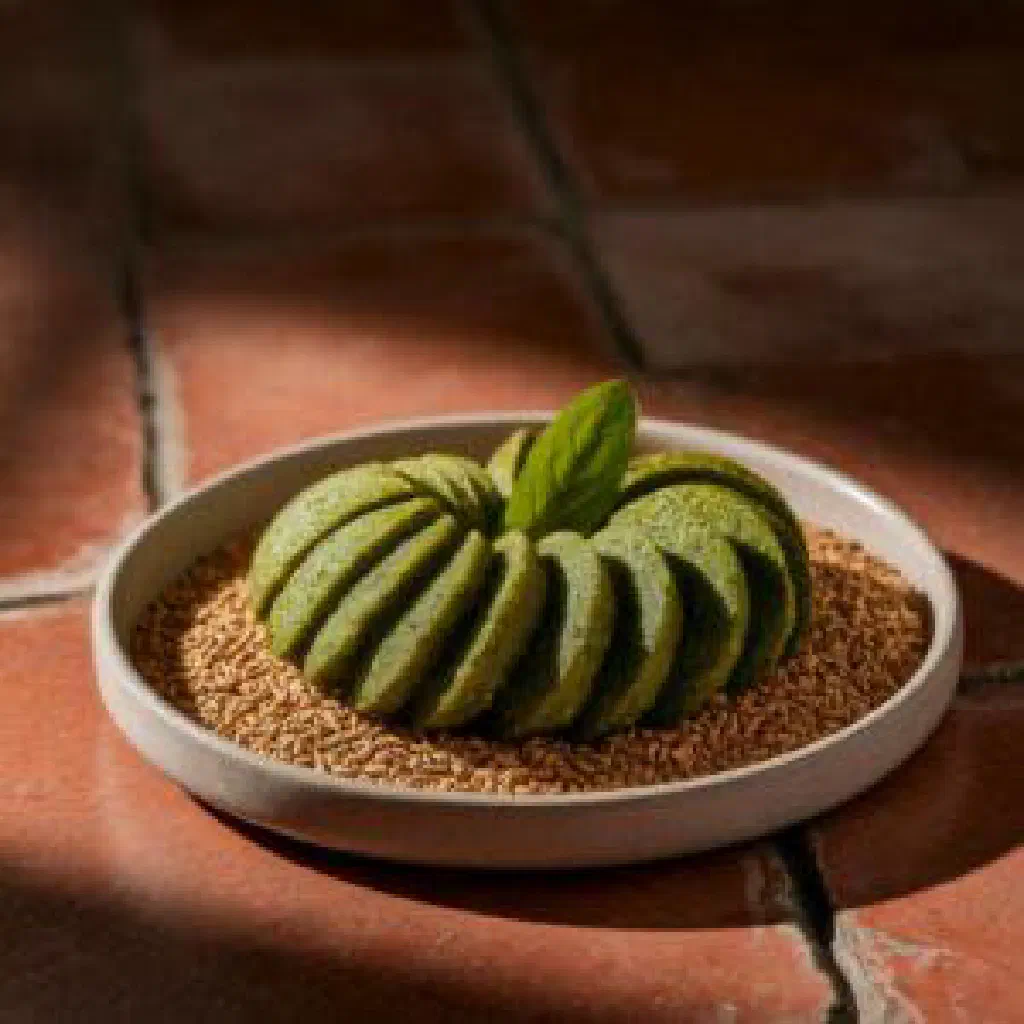 Sliced steamed patra rolls of taro leaves with a spiced gram flour filling
