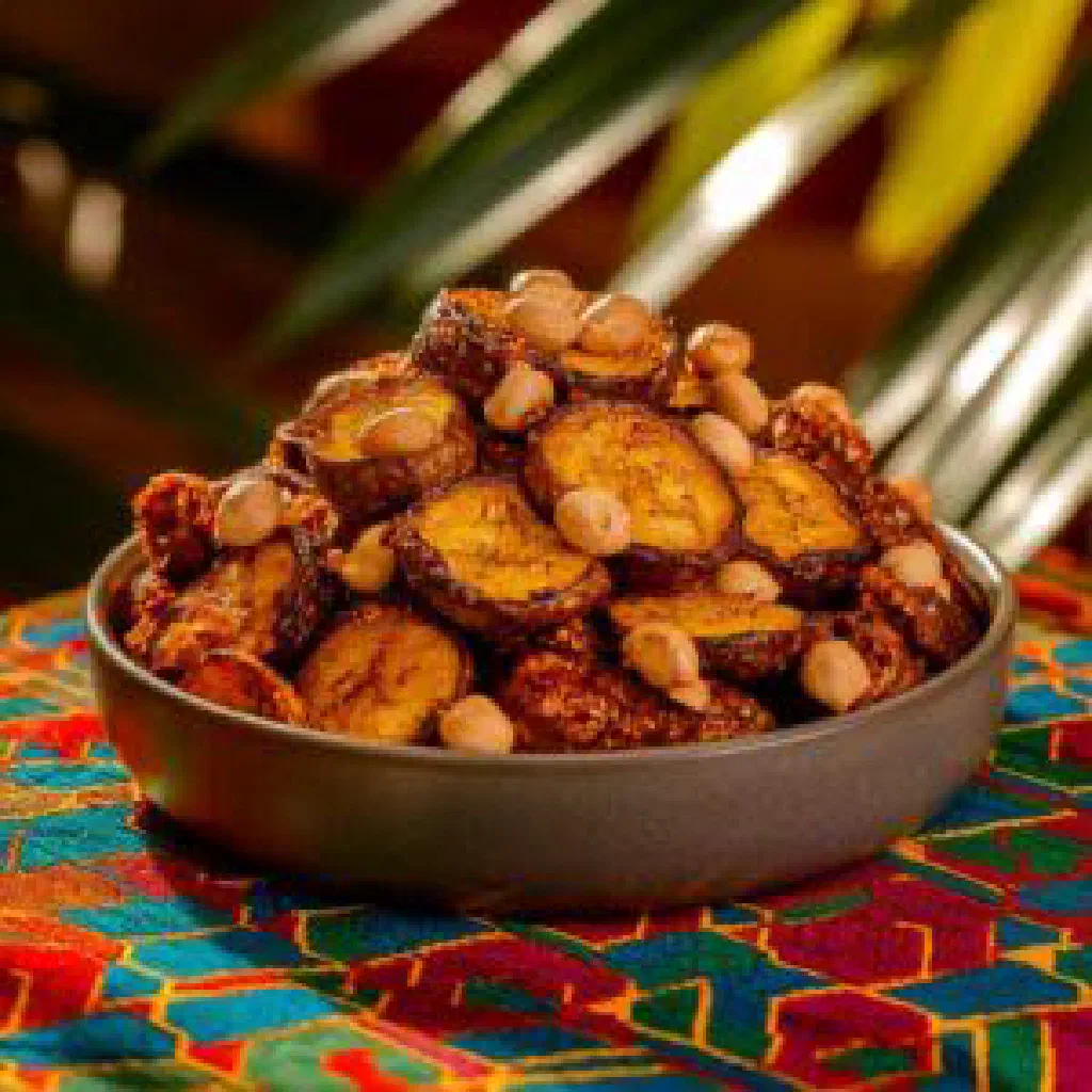 Golden fried plantain slices served with a spicy tomato sauce