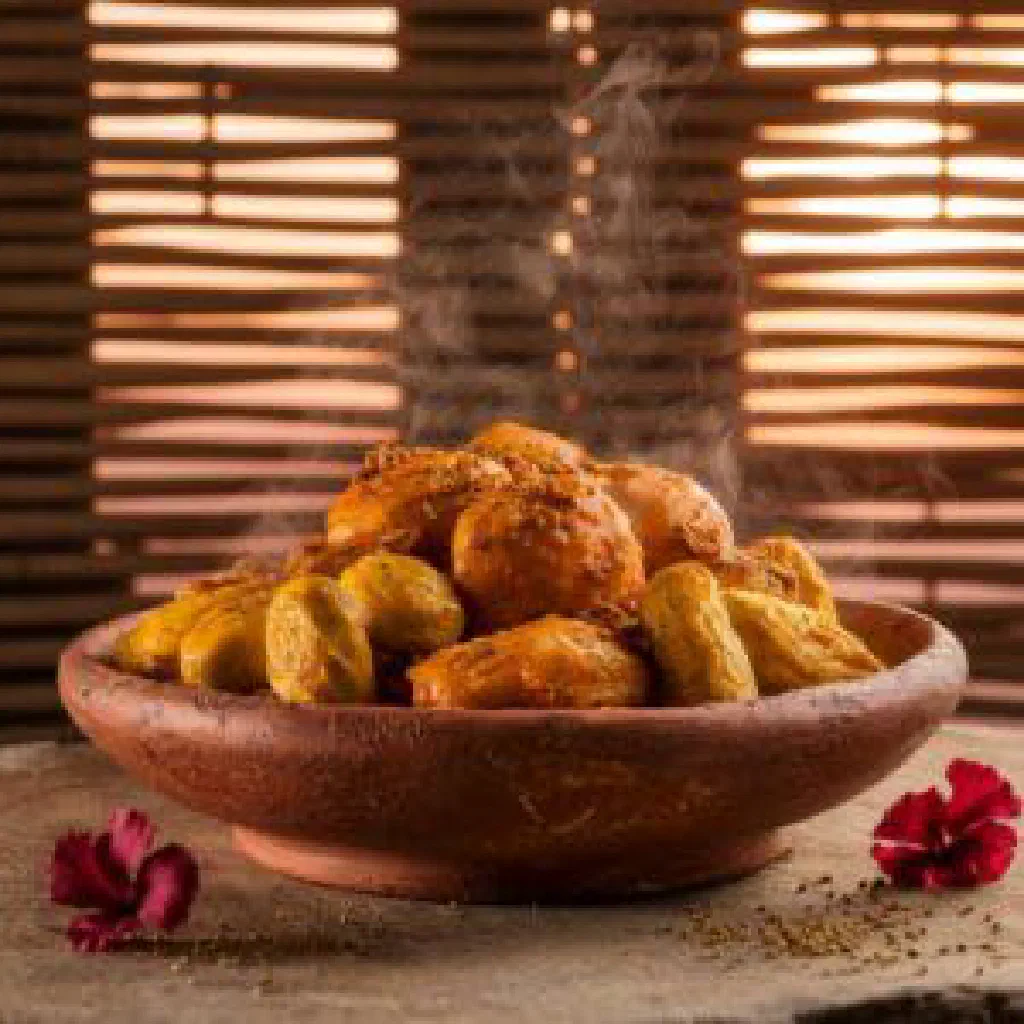 Golden-fried dakouin cassava patties with vegetables on a plate