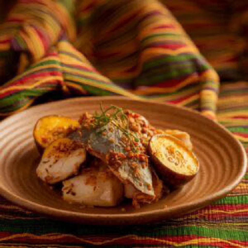Tchep poisson with grilled fish on a bed of spiced vegetable rice