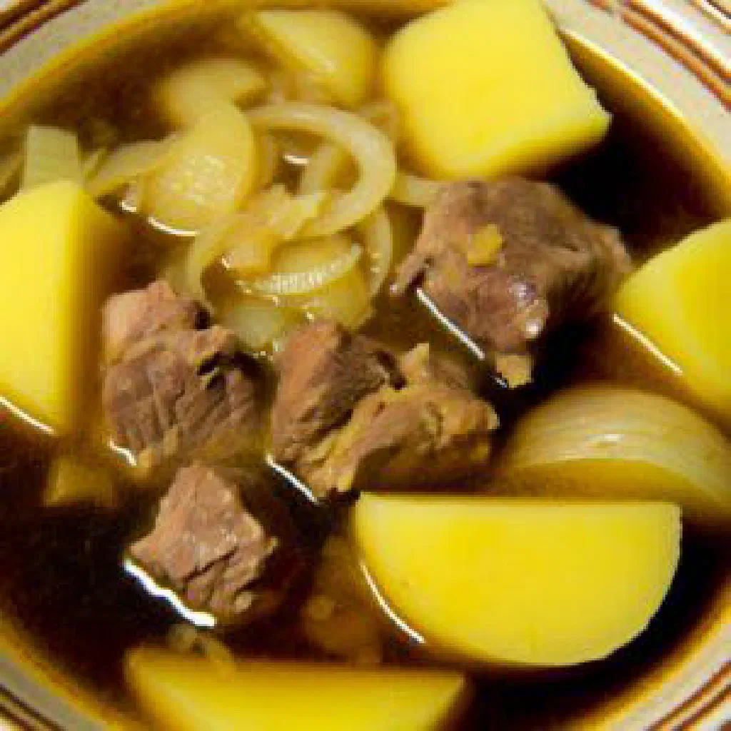 Zhayik with tender braised meat, potatoes and carrots garnished with fresh coriander