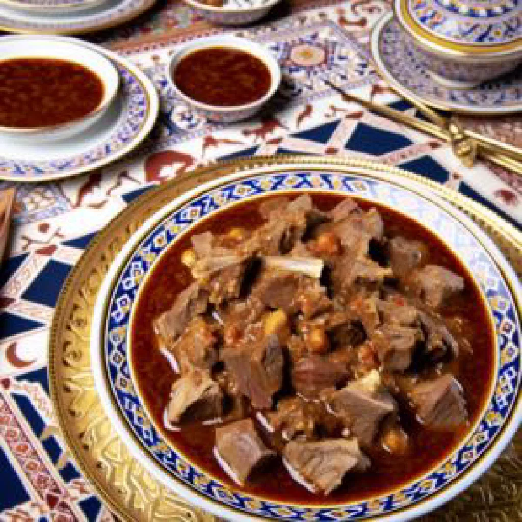 Kuwaiti saloona laham lamb stew with carrots and tomatoes, served with rice