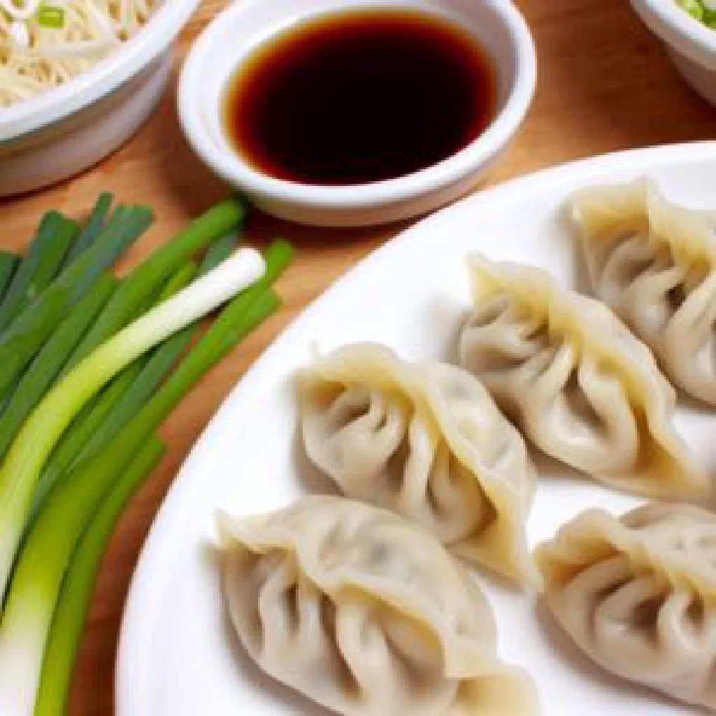 Steamed Talcan dumplings served on a plate with fresh herbs