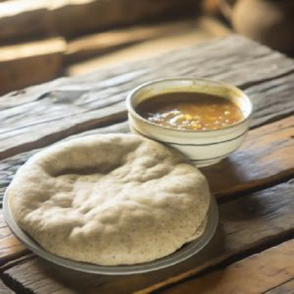 Round steamed Sephaphatha bread on a wooden board