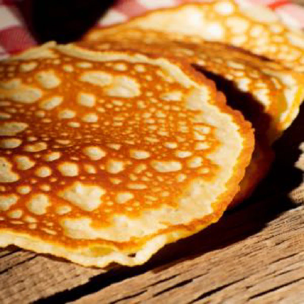 Golden crispy Libyan fried dough pieces dusted with cinnamon sugar