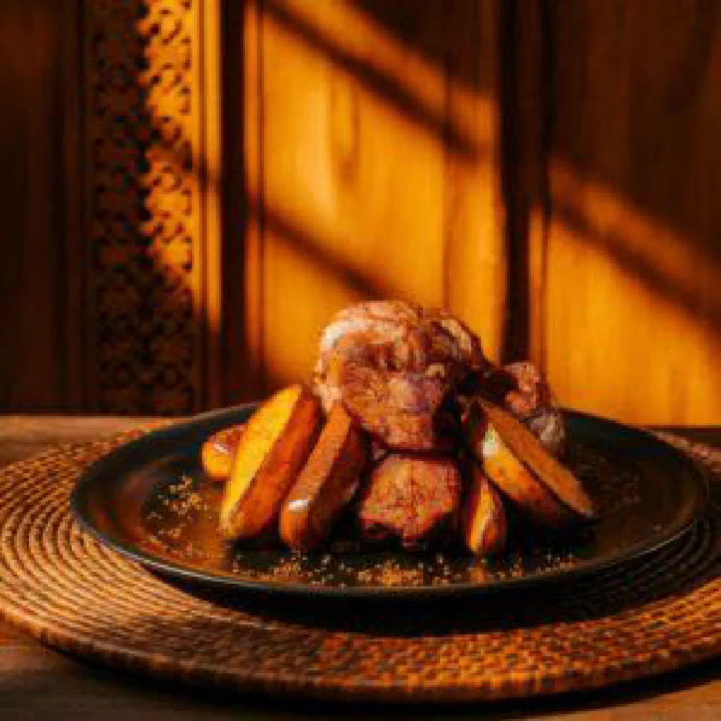 Henakisoa sy Anana with tender chicken pieces and fresh herbs in a savoury sauce