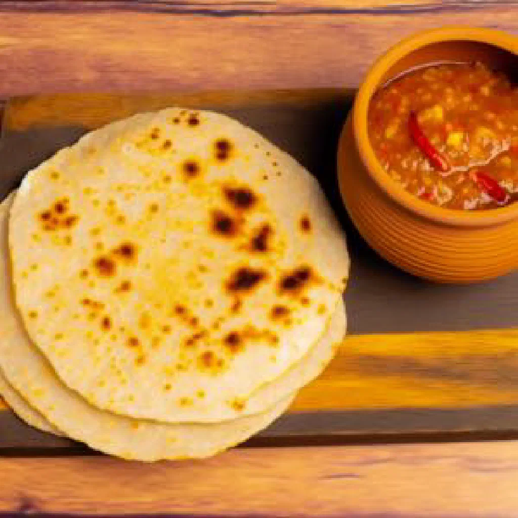A firm block of Malawian chigumu made from maize flour, served on a plate