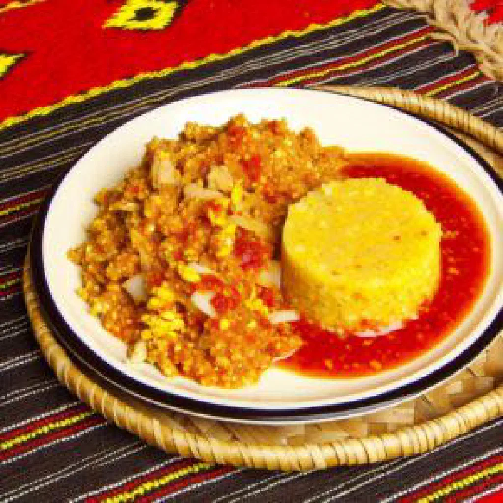 Malawian fish and groundnut stew with vegetables served in a bowl