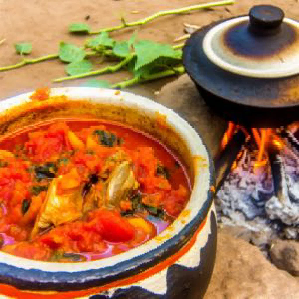 Chisoso, a Malawian maize-meal dish served with fresh green vegetables