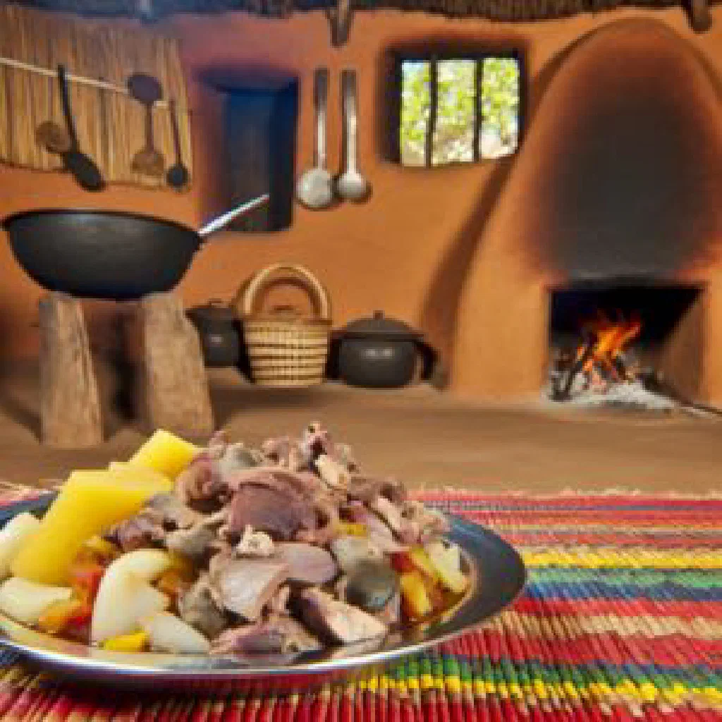 Crispy fried mbewa served with rice on a rustic plate