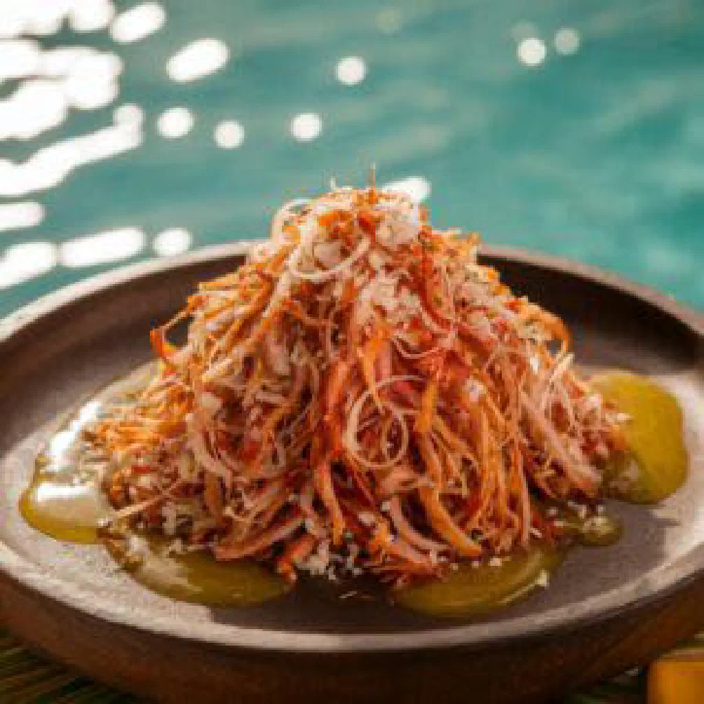 Diced tuna marinated with lime, chilli and spices, topped with grated coconut