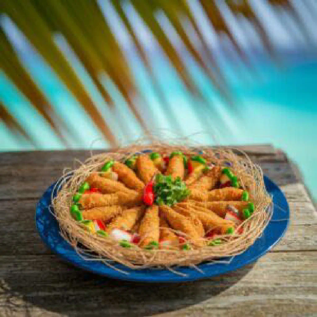 Sweet banana and grated coconut patties served warm on a plate