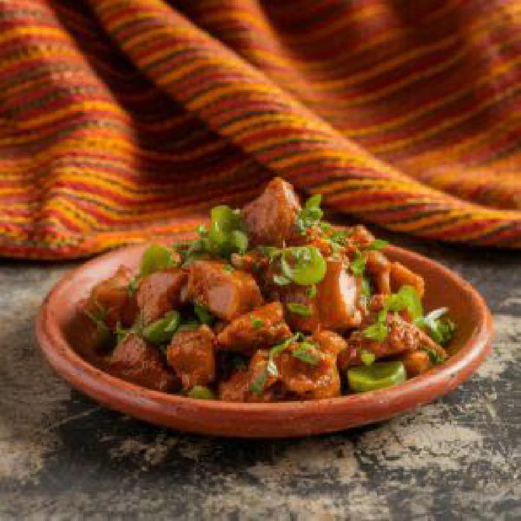 Bassi Salté with rice, colourful vegetables and tender meat in a bowl