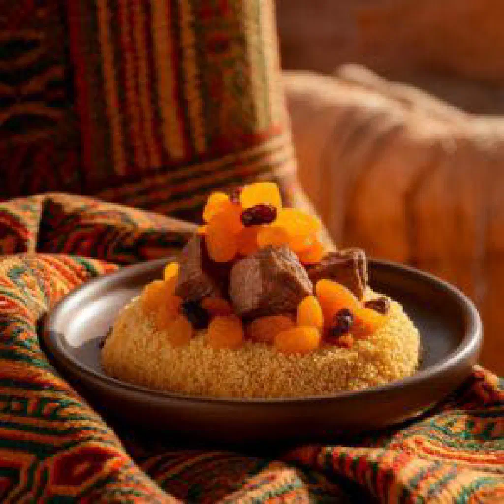 A bowl of creamy Mauritanian tiakry topped with fresh fruit