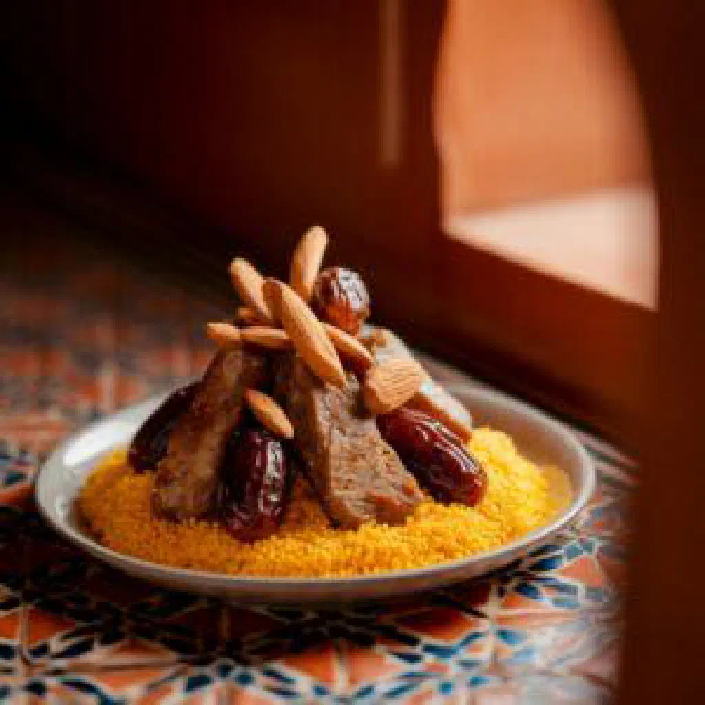 Moroccan barida chicken in a spiced saffron broth garnished with fresh coriander