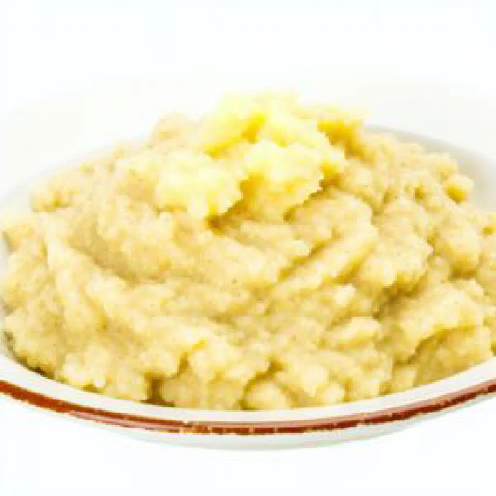 Bowl of creamy Namibian mahangu millet porridge with a spoon