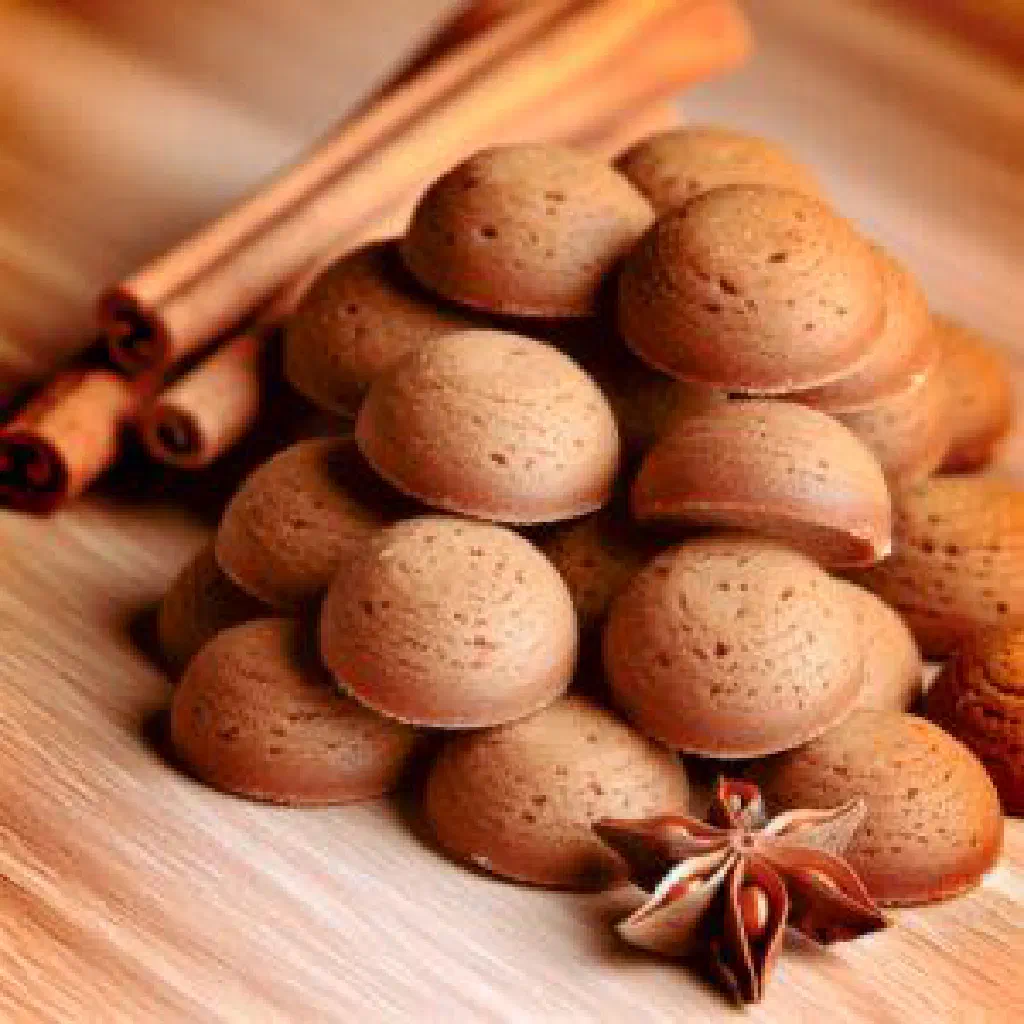 A heap of small round Dutch kruidnoten spiced biscuits