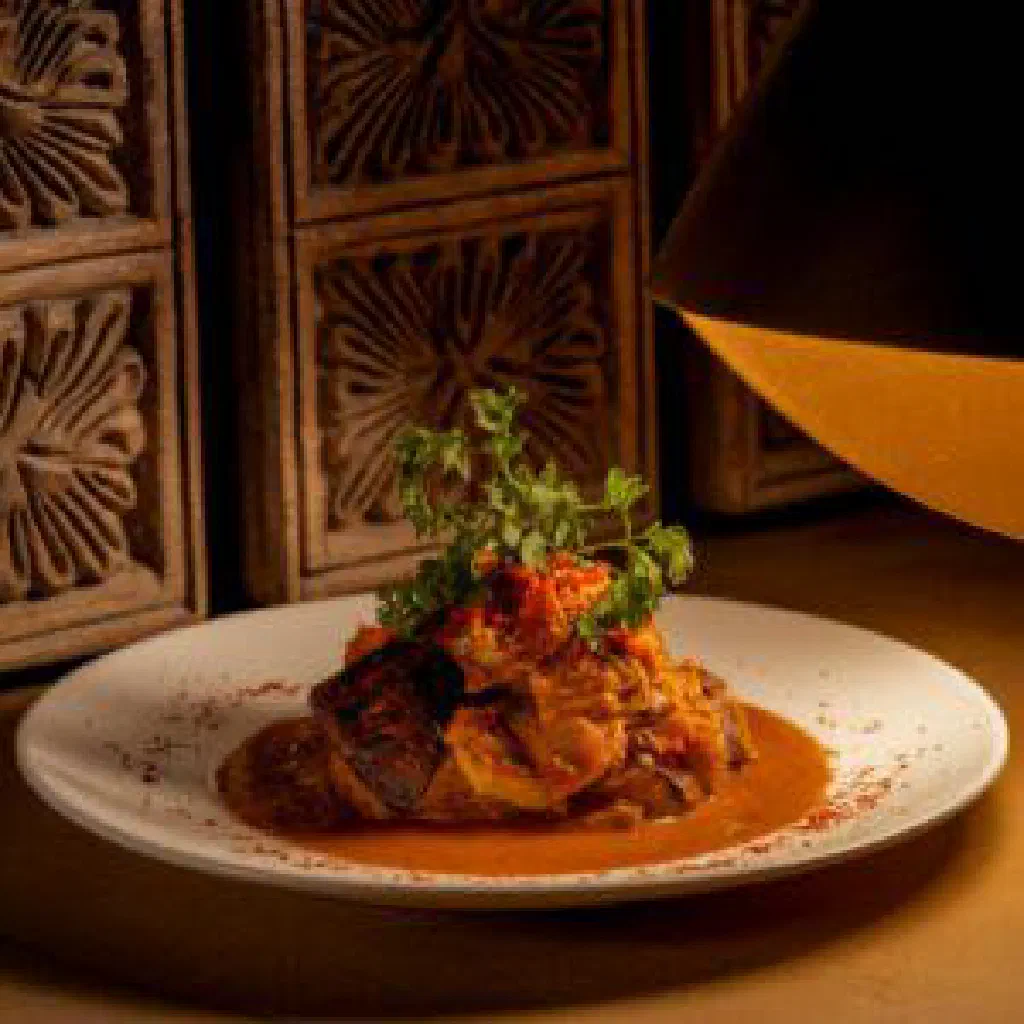 A rich Ukang Ukom stew with fish, vegetables and palm oil, served hot