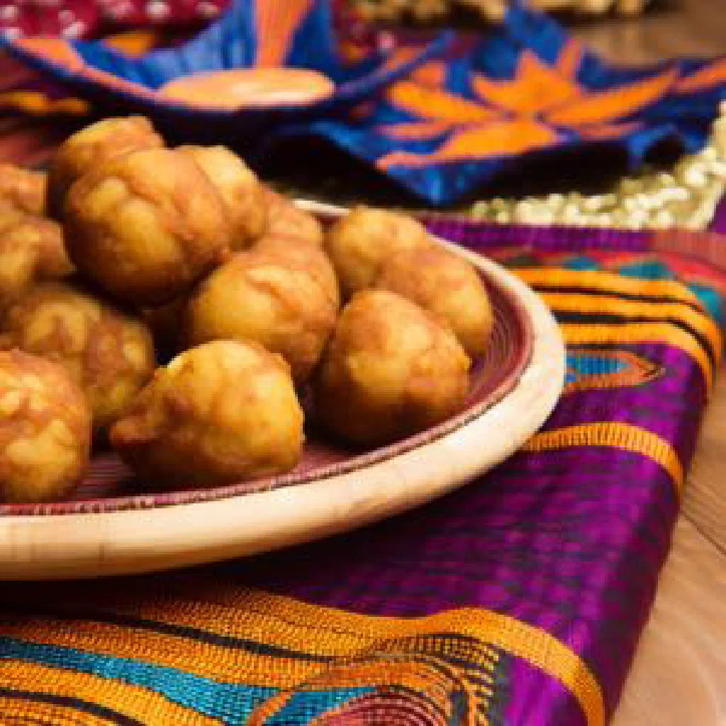Golden fried yam balls served on a plate