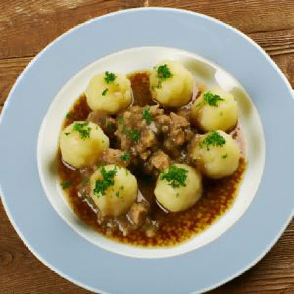 Steaming Norwegian komle potato dumplings served with butter