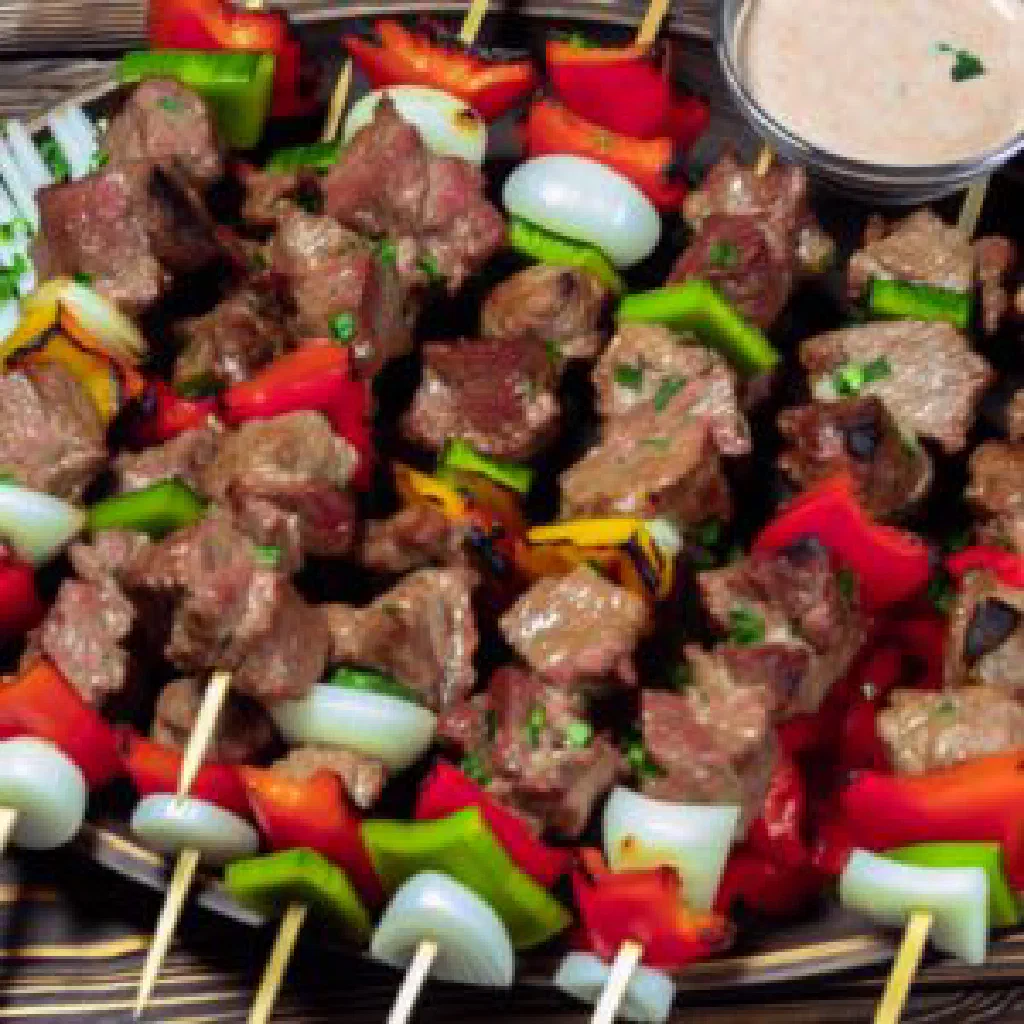 Grilled Peruvian anticuchos skewers served with potatoes